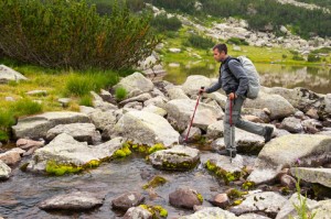 http://www.dreamstime.com/royalty-free-stock-photo-hiking-nature-young-man-across-small-river-mountain-lake-image39821815