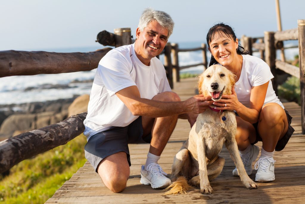 Over 40 couple with their dog and wondering how long to date before marriage.