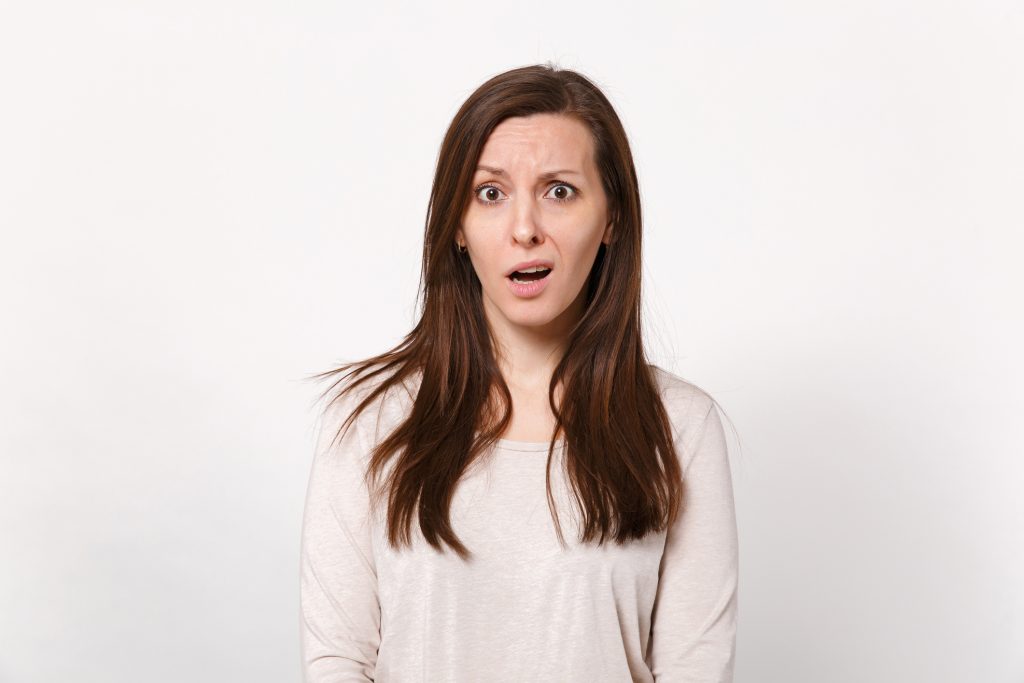 Woman with an incredulous expression.