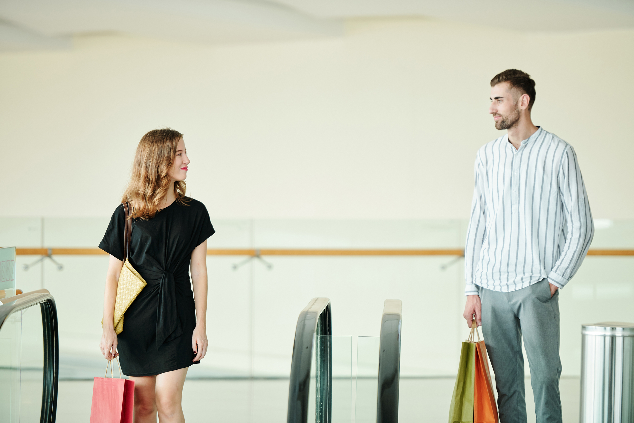 Man and woman sharing a glance wondering if they've just met the love of their life.