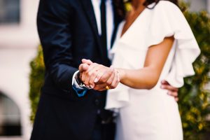 A newly married couple having their first dance.