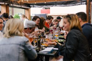 Group having a meal together and exploring the pros and cons of meetup dating.