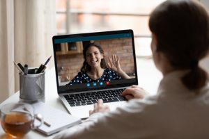 Woman on a zoom call with a high-end matchmaking service.