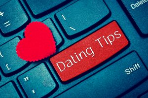 Computer keyboard with "Dating Tips" covering the enter key.
