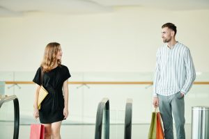 Man and woman sharing a glance wondering if they've just met the love of their life.