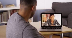Couple chatting online after meeting on an online dating site.