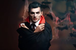 Man who is scared to date, dressed as a vampire on Halloween.